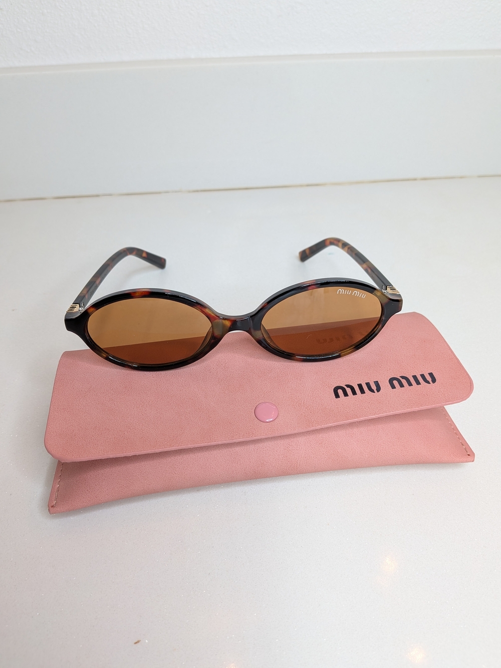 Miu Miu Tortoiseshell Oval Sunglasses in Brown - Picture 4 of 11
